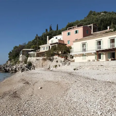 Beachfront Yellow House Upper Kaminaki Holiday home *